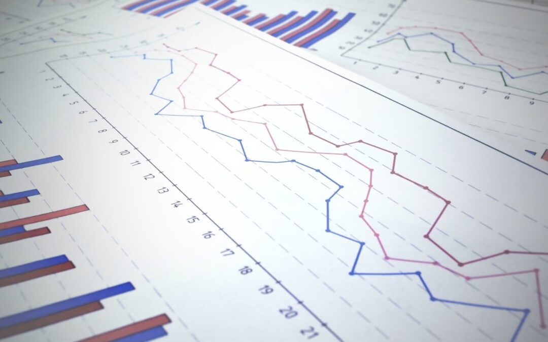 close up image of a paper with multiple graphs and charts